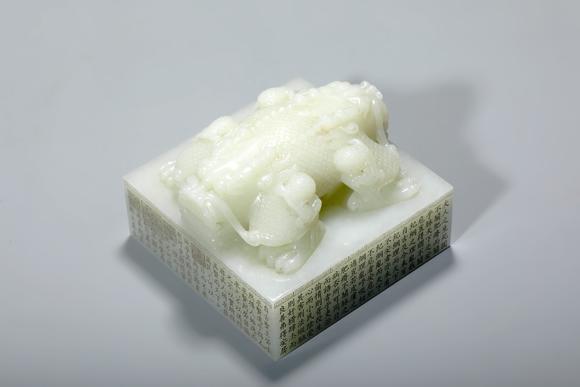 SEAVIEW AUCTIONS PTY LTDA Pale White Jade Imperial Square Seal with Double Dragon Knop and Imperial Inscription, China, 18th century