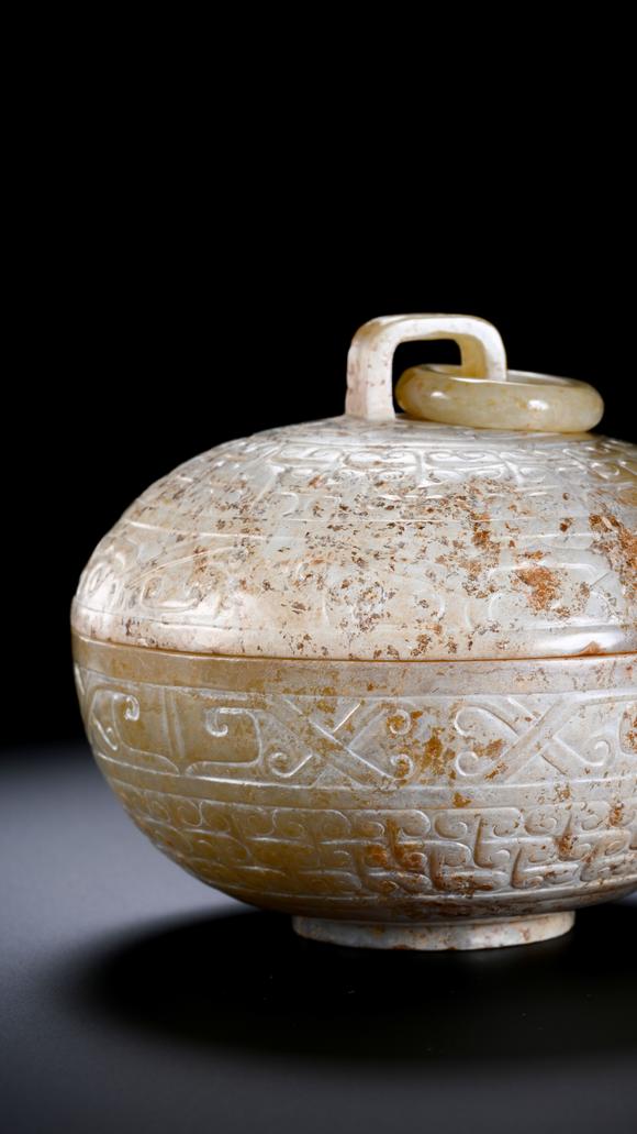 SEAVIEW AUCTIONS PTY LTDA Round White Jade Covered Box with Movable Ring Knob and Archaic Floral Scroll Carvings, 2nd BCE–3rd CE