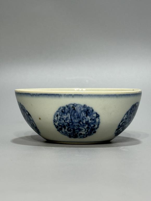 SEAVIEW AUCTIONS PTY LTDA Blue and White Bowl with Circular Floral Treasure Medallions, China, 18th century