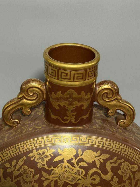 SEAVIEW AUCTIONS PTY LTDA Brown-Ground Gilt Moon Flask with Twin Ruyi Handles, Eight Treasures and Longevity Character Motifs, China, 18th century