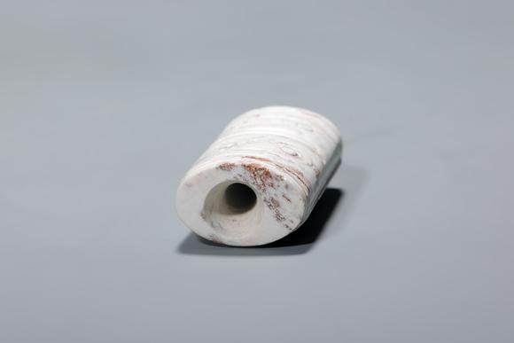 SEAVIEW AUCTIONS PTY LTDA Chicken-Bone Jade Cylindrical Cong Pendant with Double Mask Motifs, China, 3rd–2nd millennia BCE