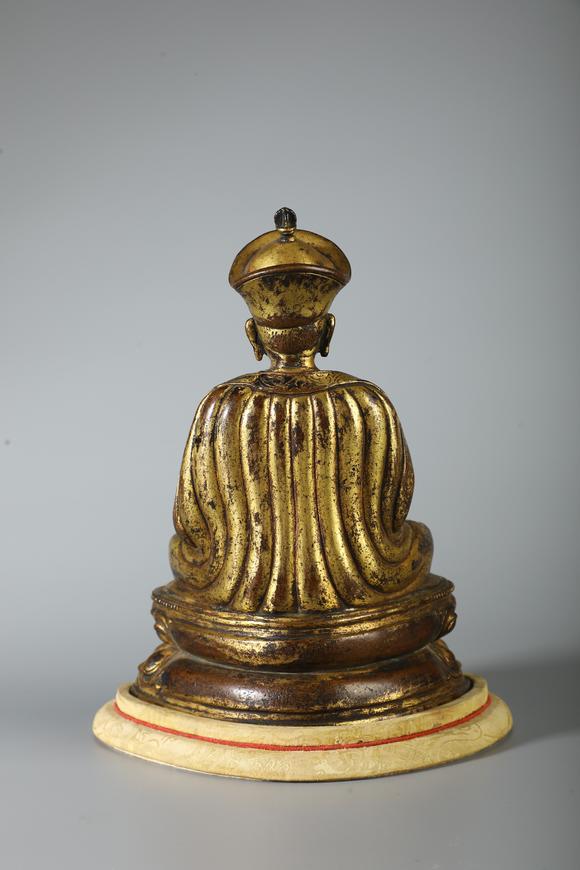 SEAVIEW AUCTIONS PTY LTDA Gilt Bronze Seated Lama Buddha Statue on Double Lotus Base, China, 18th CE