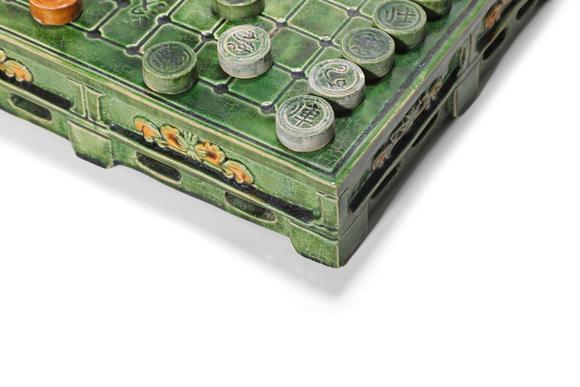 Castle AuctionA Sancai Chinese Chess Board with Chess Pieces, 12th–13th C Pr.