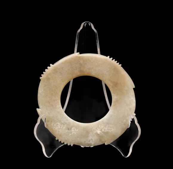 Castle AuctionA Calcified Pale Jade Notched Bi, Late Neolithic, Circa 3300–2300 C BC Pr.