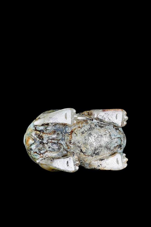 Castle AuctionA Pale Celadon Jade Mythical Beast Carving, Han, Circa 2nd C BC–2nd C AD Pr.