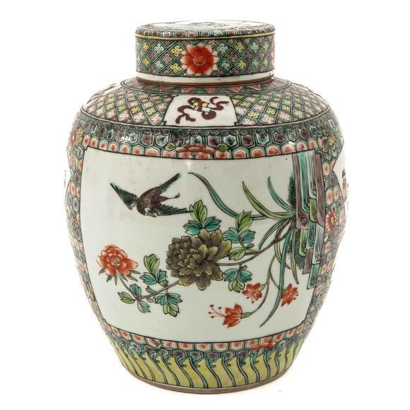 Castle AuctionA famille verte jar with cover