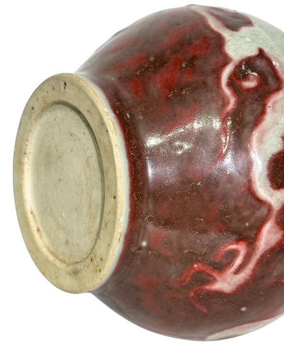 Castle AuctionThe underglaze red jar with hidden dragon pattern carvings, Ming Dynasty Pr. or earlier.