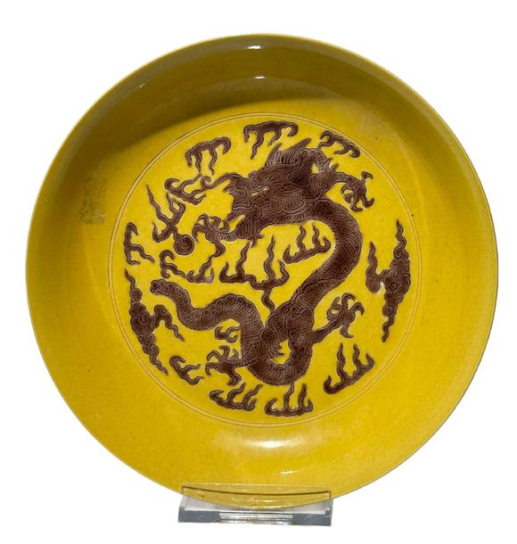 Castle AuctionYellow ground with purple dragon patterns dish, Kang Xi Pr. 
