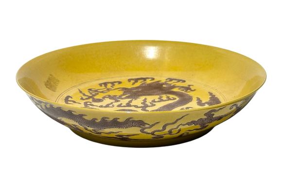 Castle AuctionYellow ground with purple dragon patterns dish, Kang Xi Pr. 