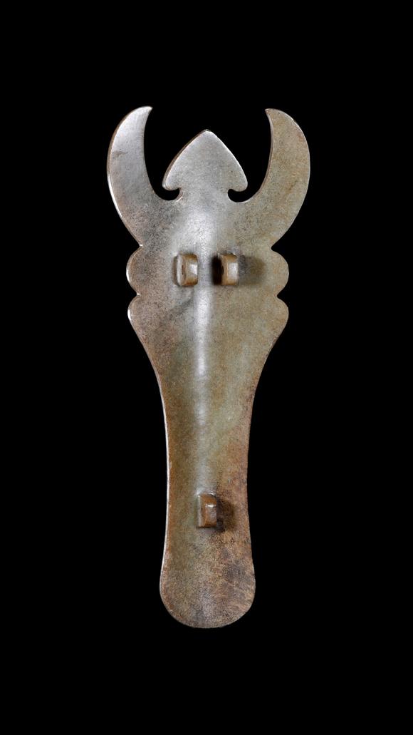 Castle AuctionA Calcified Pale Jade Ox-Headed Plaque, Western Zhou, Circa 10th–9th C BC Pr.