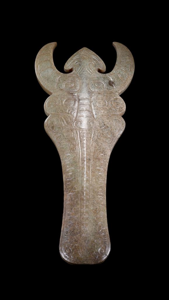 Castle AuctionA Calcified Pale Jade Ox-Headed Plaque, Western Zhou, Circa 10th–9th C BC Pr.