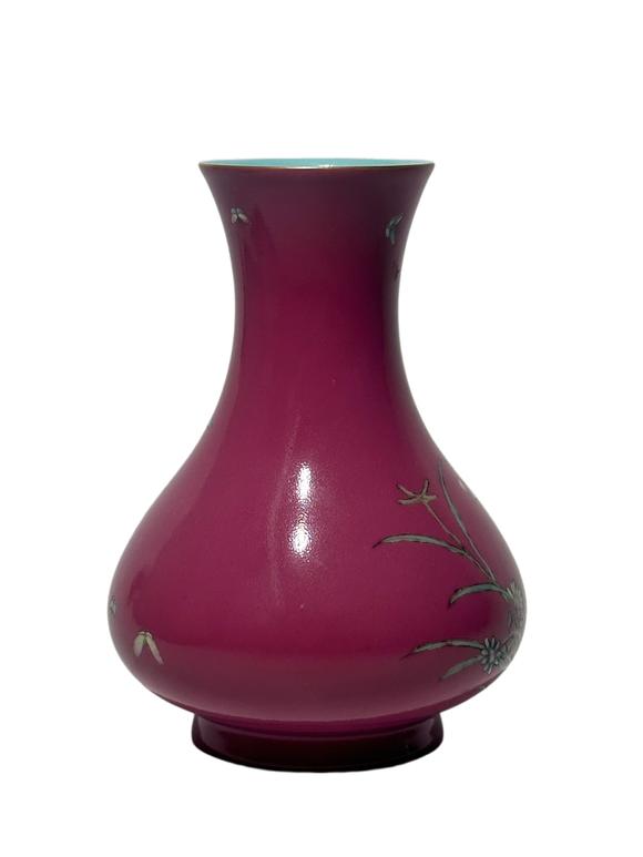 Castle AuctionA Chinese rouge-red ground famille rose vase, Qian Long Pr. 