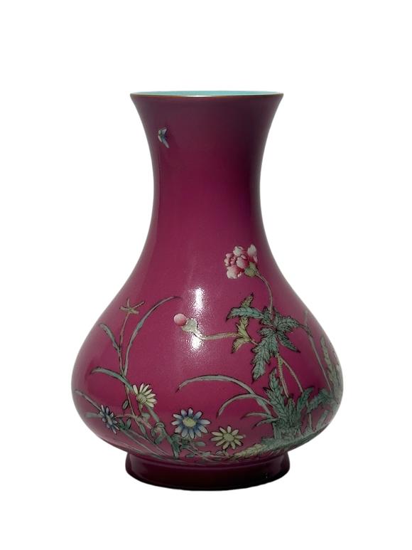 Castle AuctionA Chinese rouge-red ground famille rose vase, Qian Long Pr. 