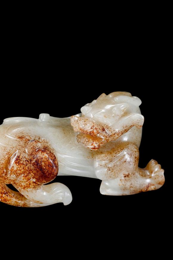Castle AuctionA White Jade Mythical Beast Carving with Russet Inclusions, Han, Circa 2nd C BC–2nd C AD Pr.