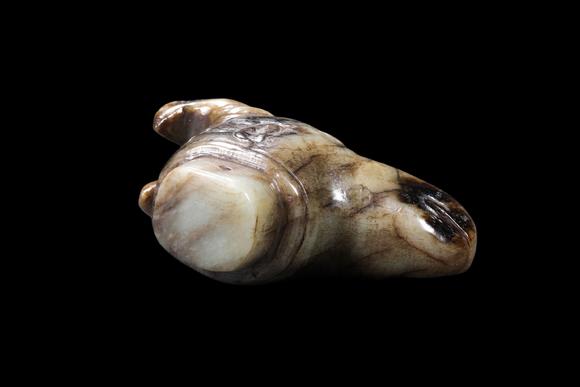 Castle AuctionA Mottled Pale Jade Ram Head Cane Finial, Han, Circa 2nd C BC–2nd C AD Pr.