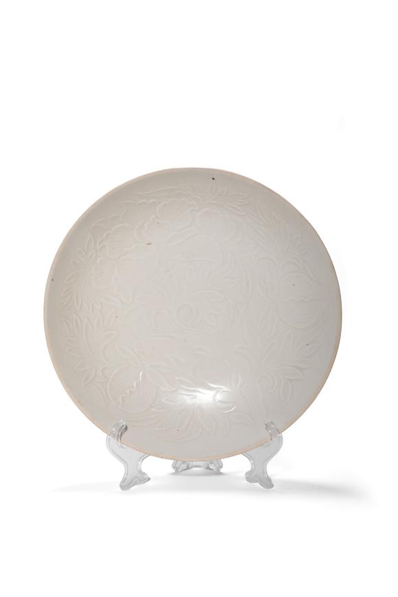 Castle AuctionA Ding Kiln White Glaze Carved Floral Plate, 10th–12th C Pr.