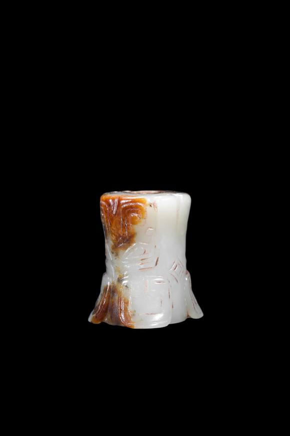 Castle AuctionA Mottled Black & Brown Jade Flared Taotie Bead, Shang, Circa 13th–11th C BC Pr.