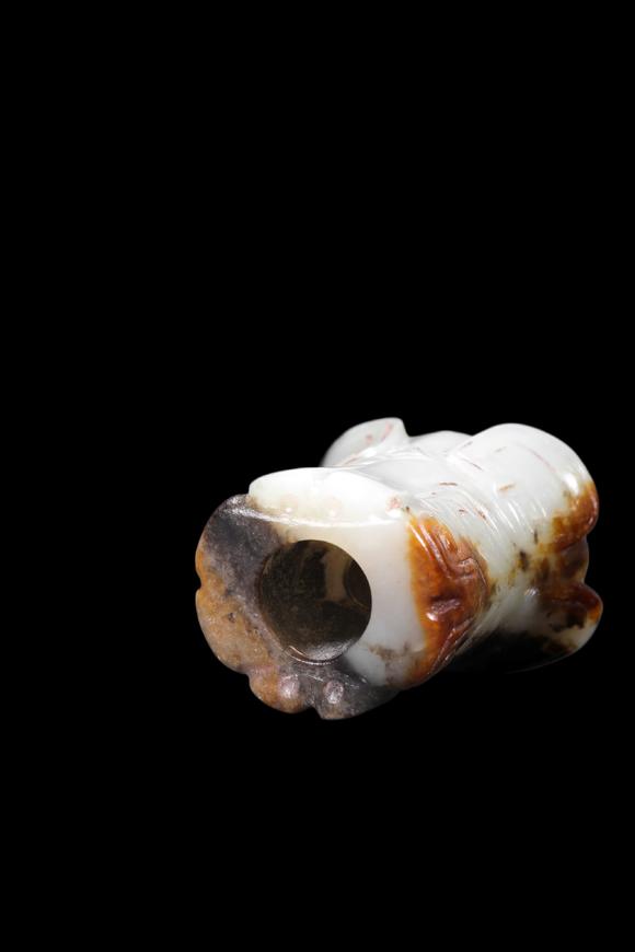 Castle AuctionA Mottled Black & Brown Jade Flared Taotie Bead, Shang, Circa 13th–11th C BC Pr.