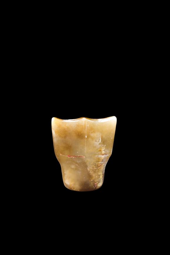 Castle AuctionA Calcified Yellow Jade Tooth-Form Pendant, Shang, Circa 13th–11th C BC Pr.