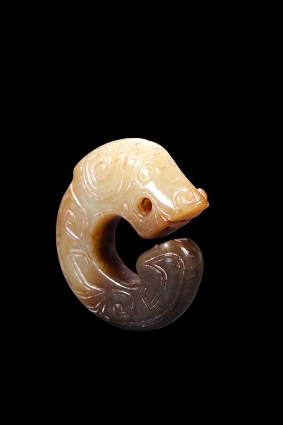 Castle AuctionA Two-Tone Jade C-Shaped Dragon Pendant, Shang, Circa 13th–11th C BC Pr.