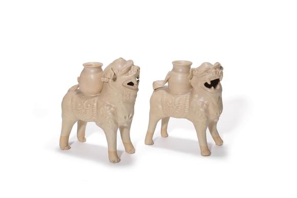 Castle AuctionA Pair of White Porcelain Lion Vase Ornaments, 7th–10th C Pr.