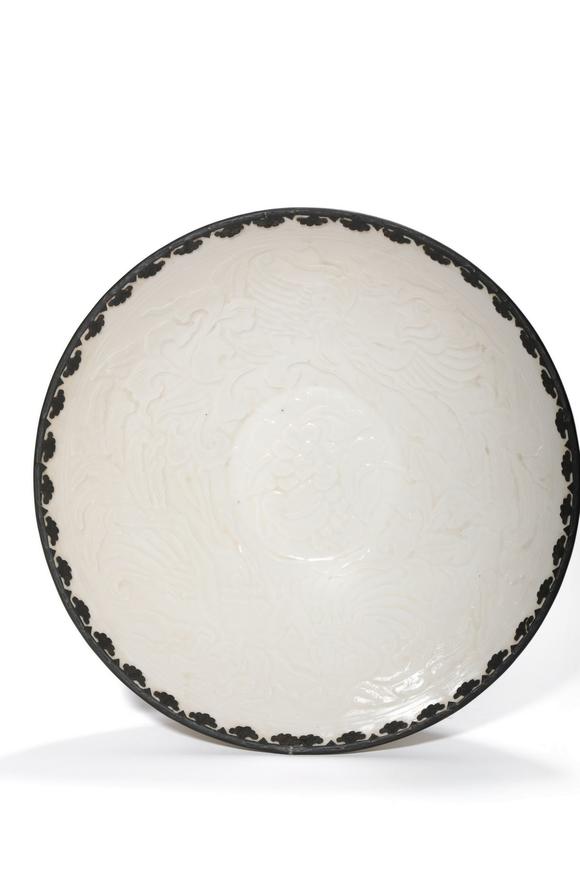 Castle AuctionA Ding Kiln Carved Floral Bowl with Metal Rim, 10th–12th C Pr.
