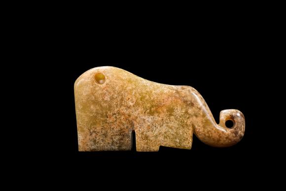Castle AuctionA Pale Calcified Jade Elephant Pendant, Late Shang, Circa 12th–11th C BC Pr.