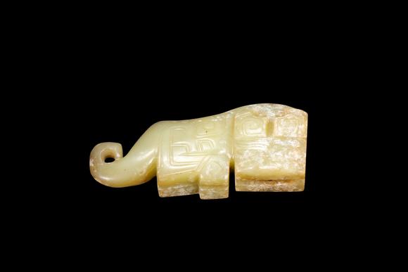 Castle AuctionA Pale Calcified Jade Elephant Pendant, Late Shang, Circa 12th–11th C BC Pr.