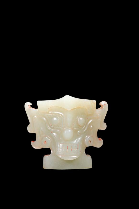 Castle AuctionA Pale Celadon Jade Taotie Mask Pendant, Shang, Circa 13th–11th C BC Pr.