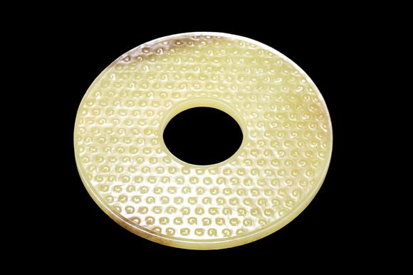 Castle AuctionA Pale Yellow Jade Granule Bi Disc, Warring States, Circa 475–221 BC Pr.