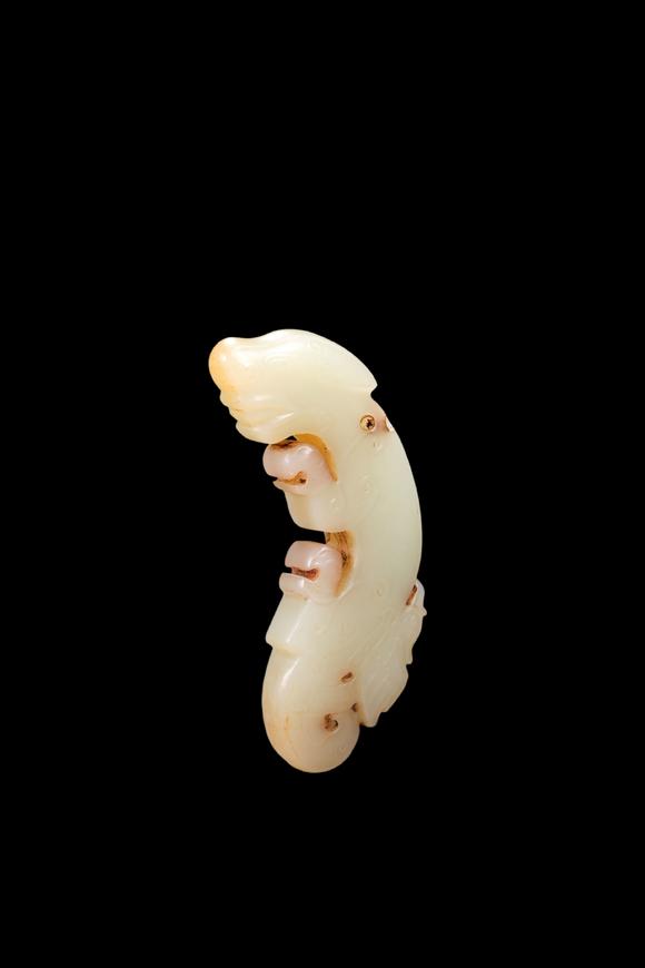 Castle AuctionA Pale Jade C-Shaped Dragon Pendant with Russet Veins, Late Shang, Circa 12th–11th C BC Pr.