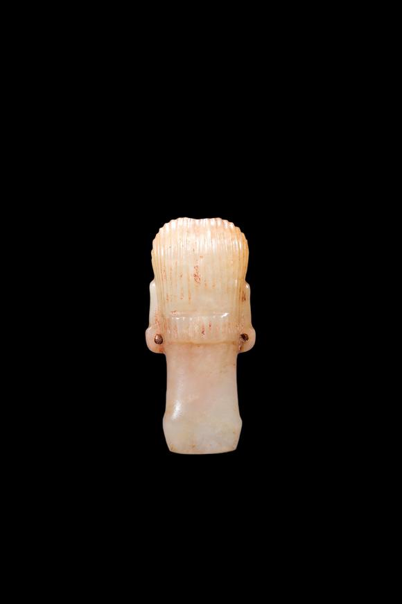 Castle AuctionA Pale Jade Human Head Bead with Russet Inclusions, Shang, Circa 13th–11th C BC Pr.