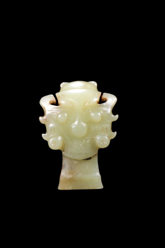 Castle AuctionA Pale Yellow Jade Human Mask Pendant, Shang, Circa 13th–11th C BC Pr.