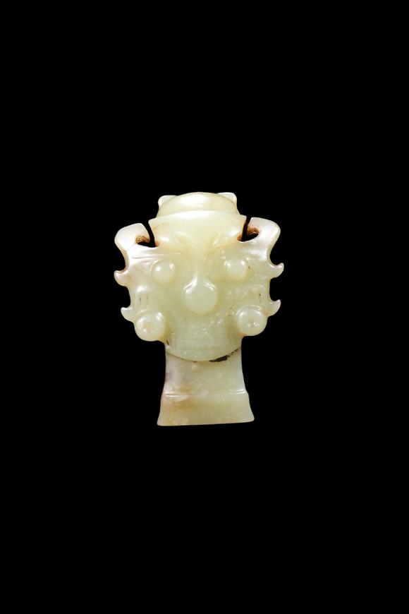 Castle AuctionA Pale Yellow Jade Human Mask Pendant, Shang, Circa 13th–11th C BC Pr.