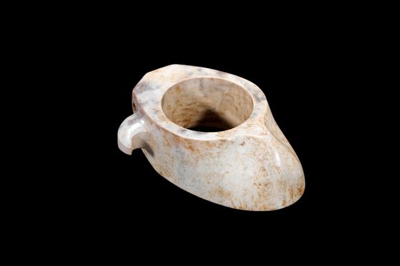 Castle AuctionA Calcified Pale Jade Archer's Ring, Warring States, Circa 475–221 BC Pr.