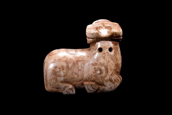 Castle AuctionA Calcified Pale Jade Recumbent Ox Carving, Shang, Circa 13th–11th C BC Pr.
