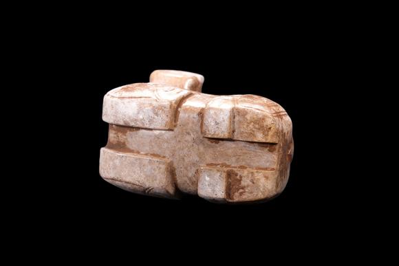Castle AuctionA Calcified Pale Jade Recumbent Ox Carving, Shang, Circa 13th–11th C BC Pr.