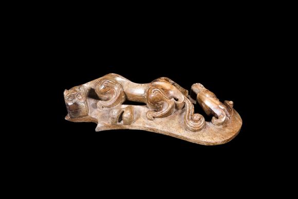 Castle AuctionA Mottled Brown Jade Double Chilong Belt Ornament, Han, Circa 2nd C BC–2nd C AD Pr.