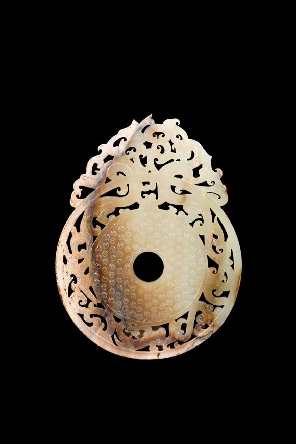 Castle AuctionA Pale Yellow Jade Openwork Dragon Phoenix Bi Disc, Han, Circa 2nd C BC–2nd C AD Pr.