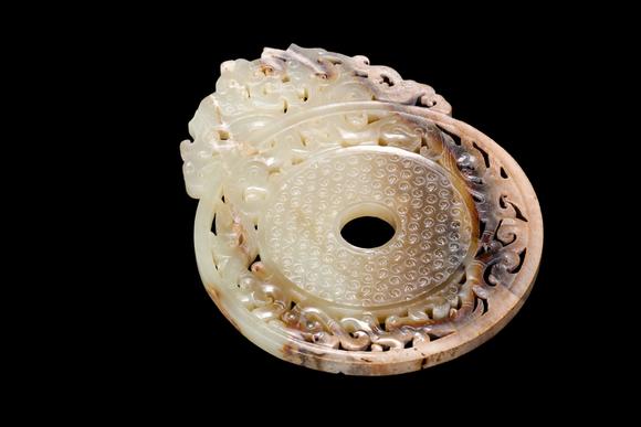Castle AuctionA Pale Yellow Jade Openwork Dragon Phoenix Bi Disc, Han, Circa 2nd C BC–2nd C AD Pr.