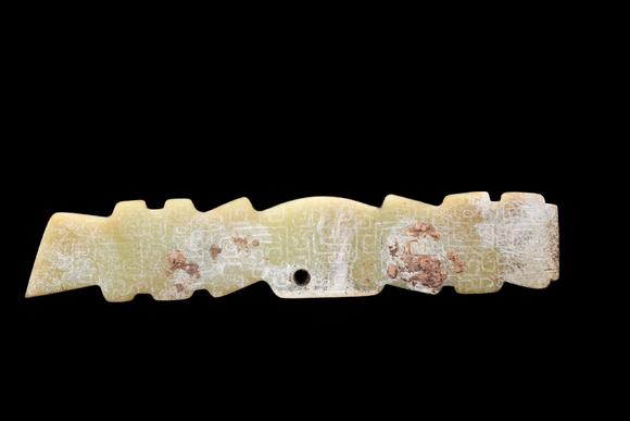 Castle AuctionA Pale Yellow Jade Serrated Dragon Plaque, Western Zhou, Circa 10th–9th C BC Pr.