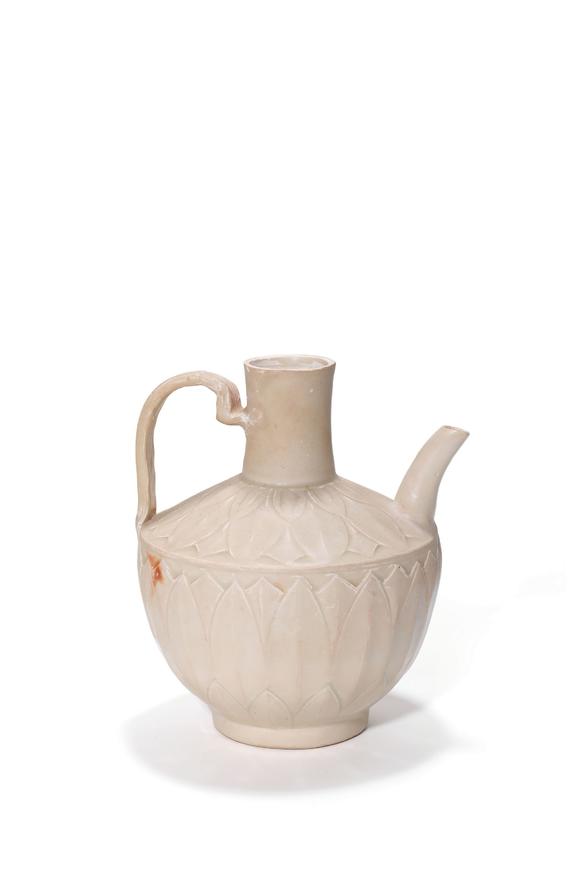 Castle AuctionA White Glaze Carved Lotus Ewer, 10th–12th C Pr.