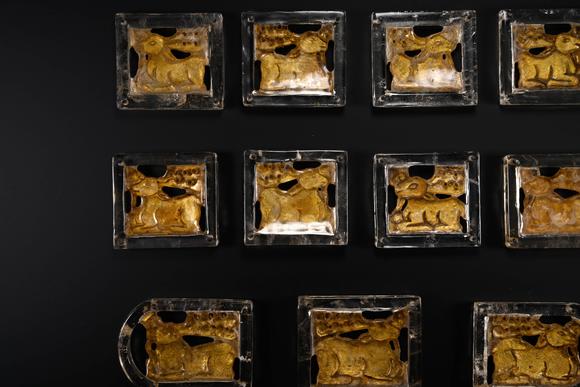Cascade'sEleven-piece set with square pattern of Han and Rui animals. | 漢 鏨瑞獸紋方形帶銙十一件成套