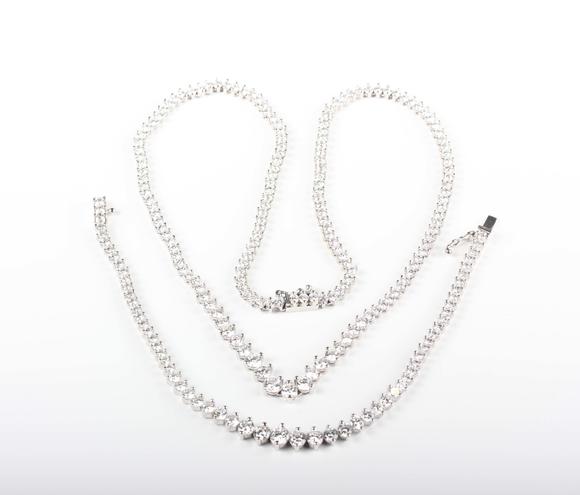 TooveysA white gold and colourless cubic zirconia demi-parure, comprising a graduated necklace and bracelet, each mounted with circular cut colourless cubic