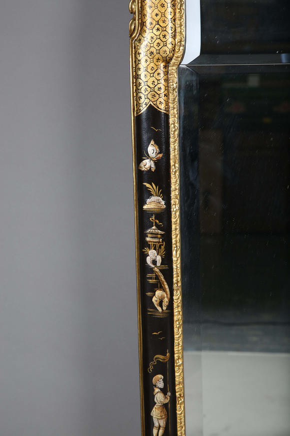 TooveysAn impressive pair of early 20th century Queen Anne style gilt and black japanned pier mirrors, each shaped crest with central shell and griffon heads