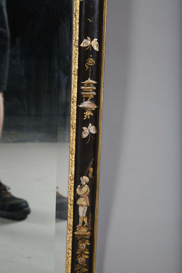 TooveysAn impressive pair of early 20th century Queen Anne style gilt and black japanned pier mirrors, each shaped crest with central shell and griffon heads