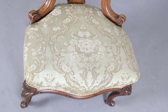 TooveysA mid-Victorian walnut showframe salon chair, height 97cm, width 51cm.