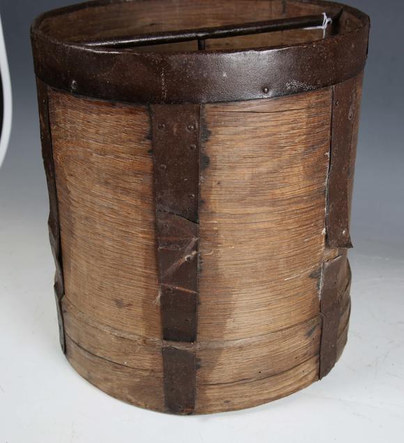 TooveysA 19th century French bentwood and metal bound grain measure, the underside stamped 'CORDIER', height 33cm, diameter 30cm.
