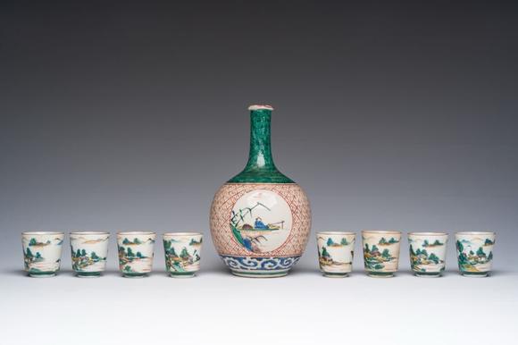 Coronari Auctions BVA Japanese Kutani 'tokuri' or sake bottle and eight cups with landscape design, Meiji, 19th C.