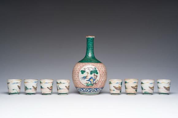 Coronari Auctions BVA Japanese Kutani 'tokuri' or sake bottle and eight cups with landscape design, Meiji, 19th C.